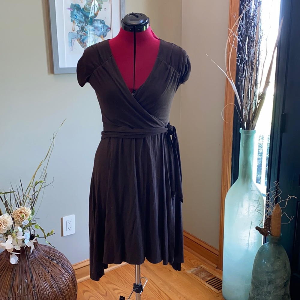 Brown faux wrap dress with asymmetric hemline.